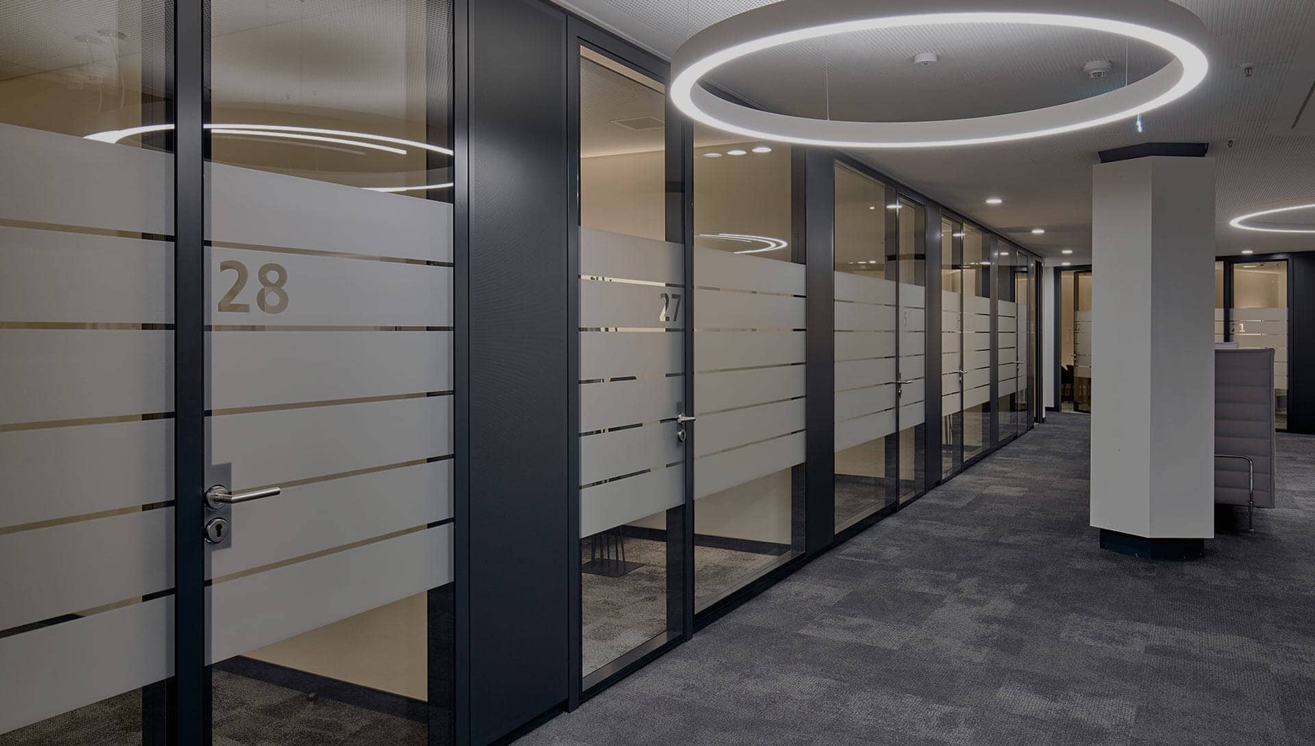 Glass walls to separate workplaces, corridor view of the entire floor